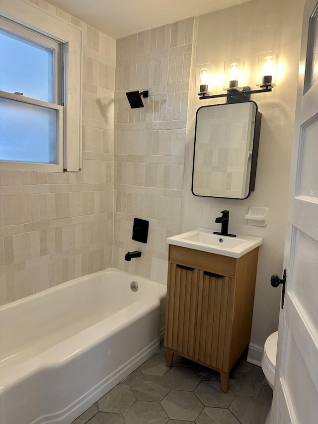 full bath featuring shower / washtub combination, vanity, toilet, and tile patterned floors