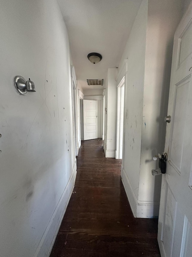 hallway featuring dark wood-type flooring