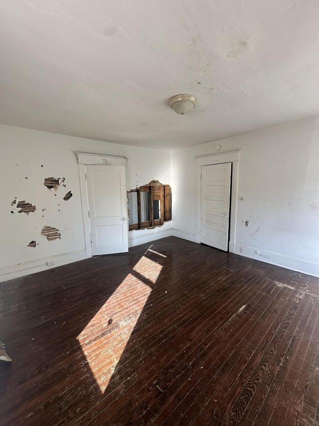 interior space with dark hardwood / wood-style flooring