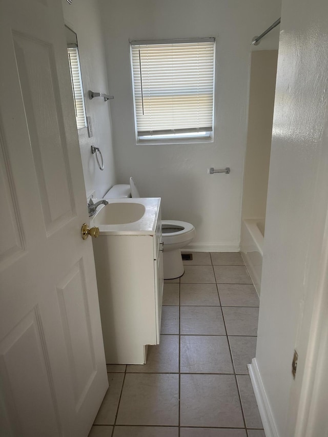 full bathroom featuring vanity,  shower combination, tile patterned floors, and toilet