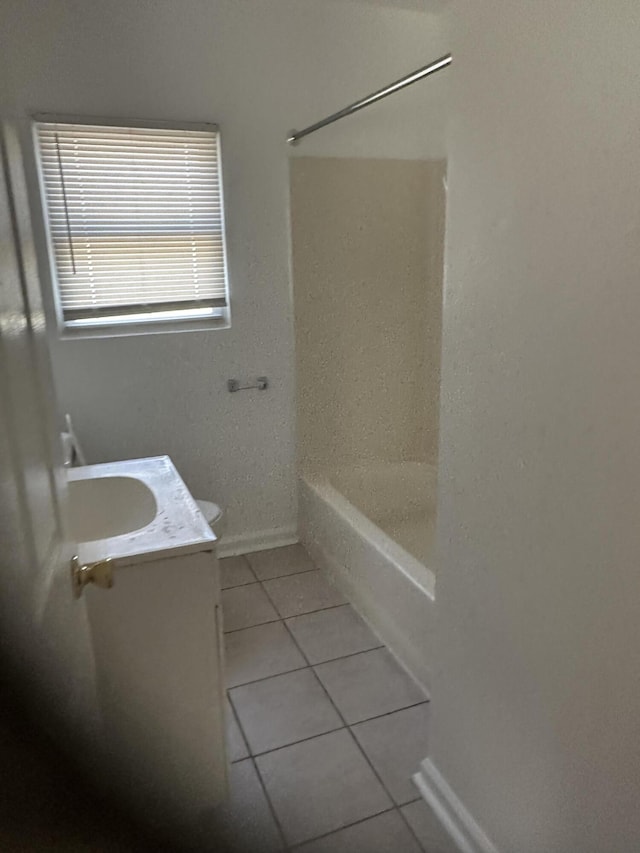 full bathroom with tile patterned flooring, vanity, bathtub / shower combination, and toilet