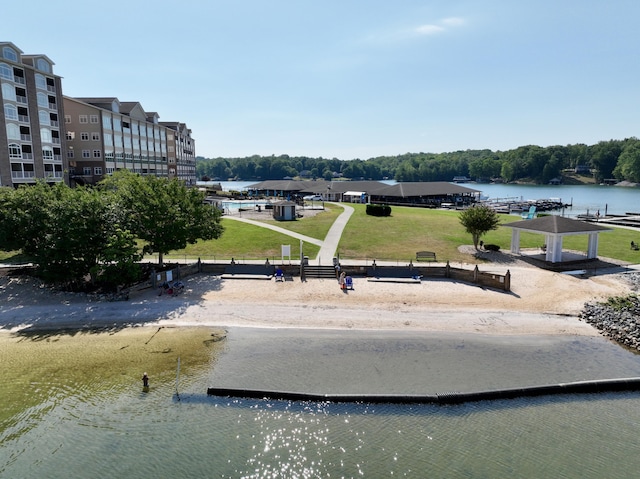 surrounding community featuring a yard, a water view, and a gazebo