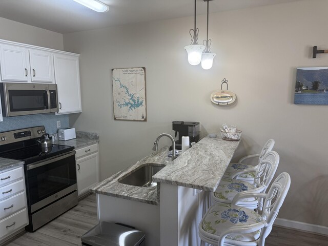 bathroom featuring vanity, toilet, and a shower with shower door