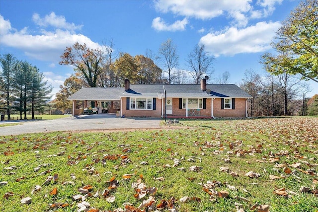 back of property with a lawn and a patio