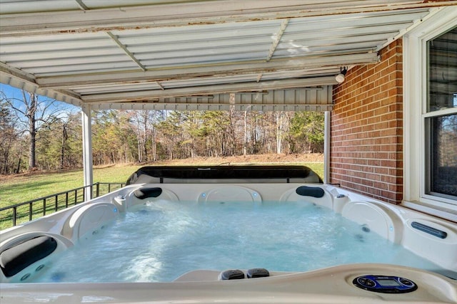 view of swimming pool with a hot tub