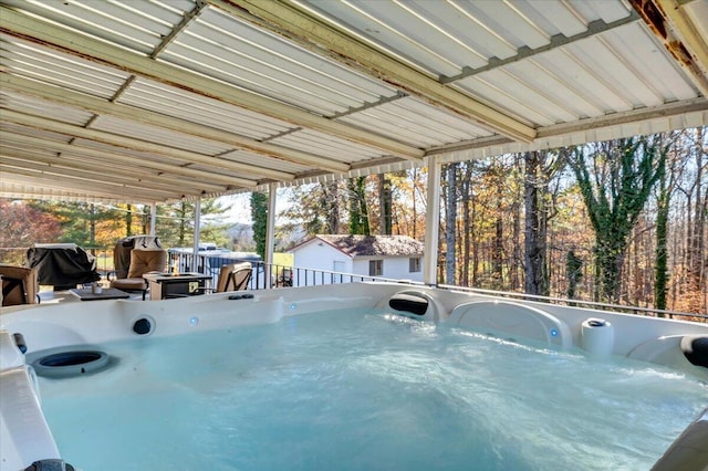 view of swimming pool with a grill, a hot tub, and a wooden deck