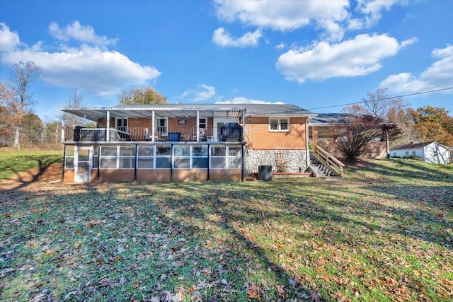 back of house featuring a yard