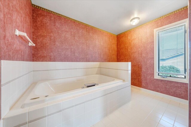 bathroom featuring tiled tub and tile patterned floors