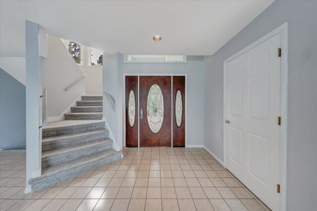 entrance foyer with light tile patterned floors