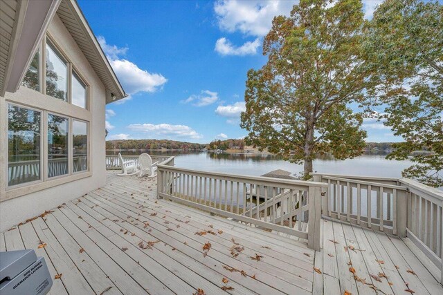 wooden terrace featuring a water view