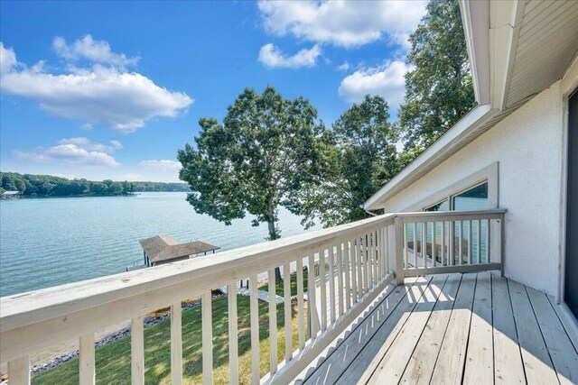 wooden deck featuring a water view