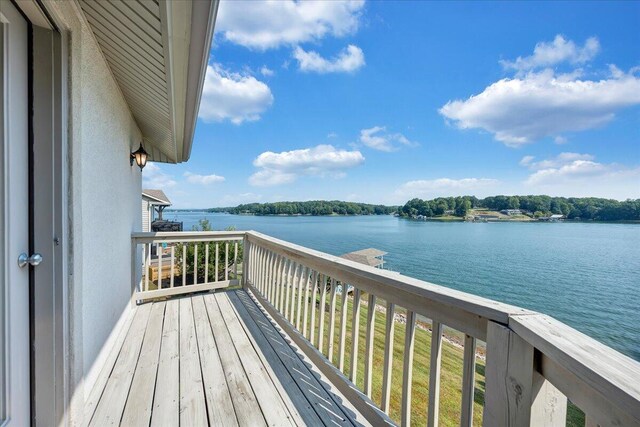 balcony featuring a water view