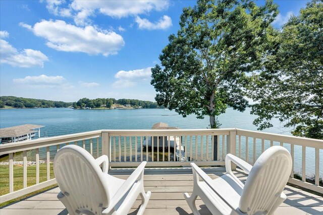 wooden deck with a water view