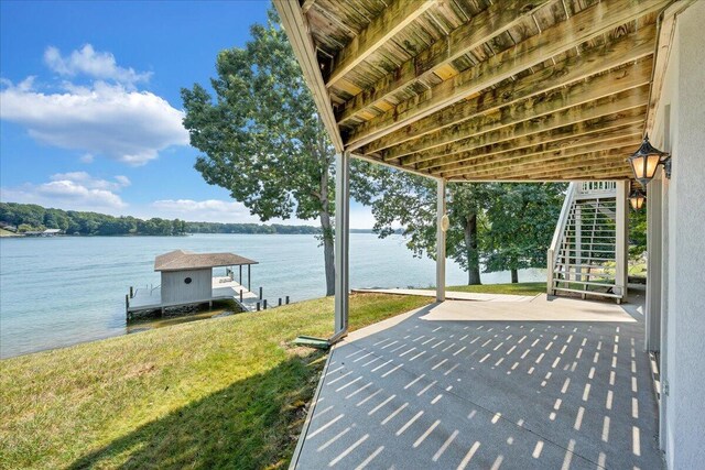 exterior space featuring a water view and a boat dock