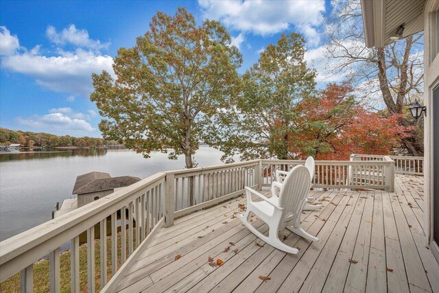 wooden deck featuring a water view