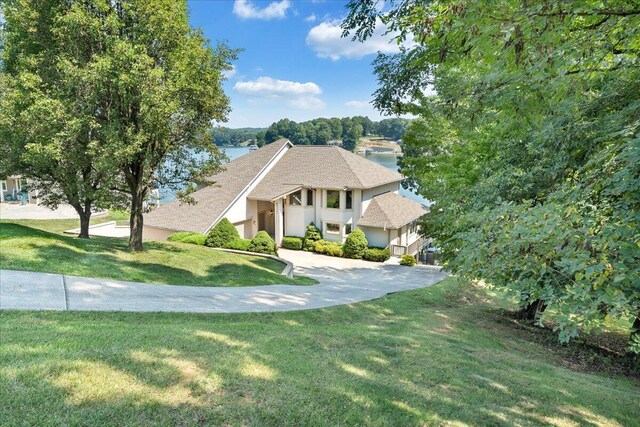 view of front of house featuring a water view and a front yard