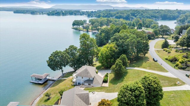 bird's eye view with a water and mountain view