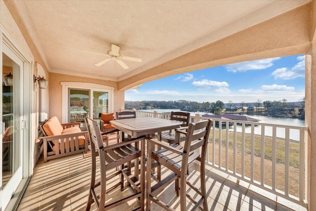 wooden terrace featuring a water view and ceiling fan