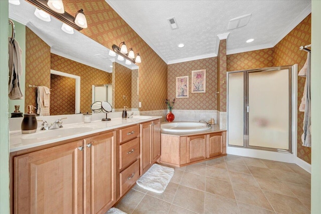 bathroom with shower with separate bathtub, a textured ceiling, ornamental molding, vanity, and tile patterned flooring