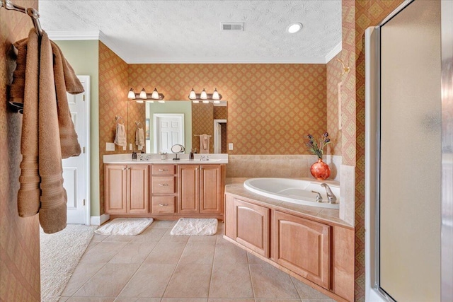 bathroom with crown molding, vanity, shower with separate bathtub, and a textured ceiling