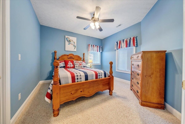 bedroom featuring light carpet and ceiling fan