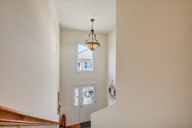 entryway with a textured ceiling