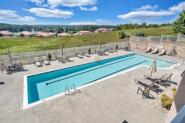 view of swimming pool with a patio area