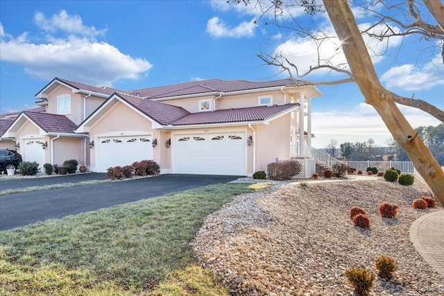 view of front facade featuring a garage and a front lawn