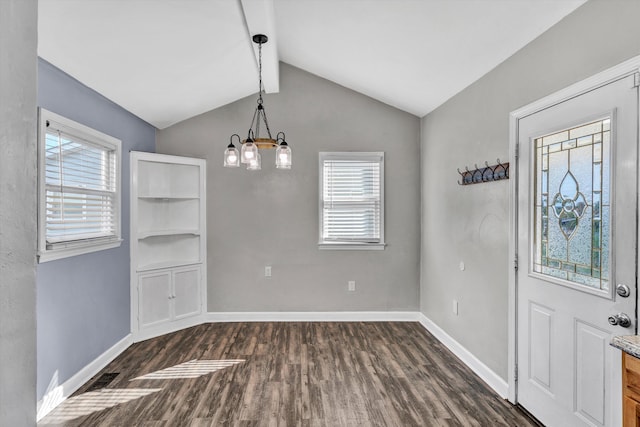 unfurnished dining area featuring an inviting chandelier, dark hardwood / wood-style floors, and vaulted ceiling