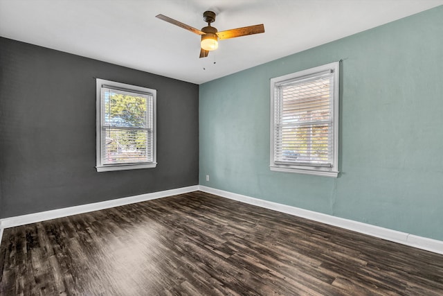 unfurnished room with dark hardwood / wood-style floors and ceiling fan