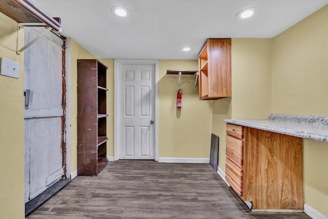 kitchen with dark wood-type flooring