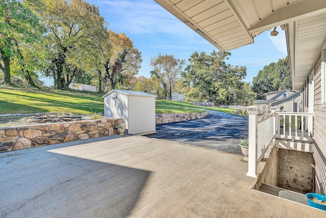 view of patio featuring a storage shed