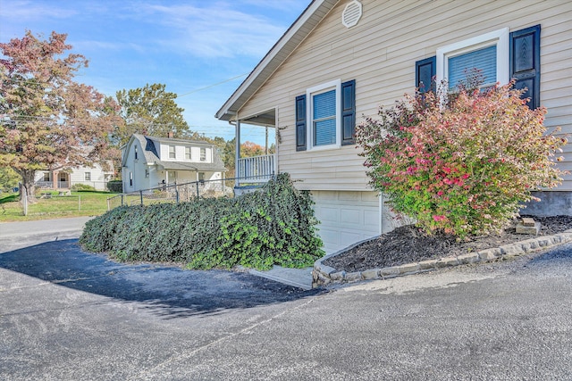 view of side of property featuring a garage