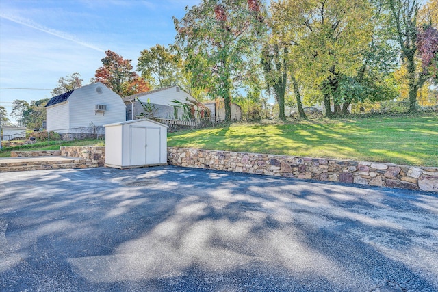 view of patio / terrace featuring a storage shed