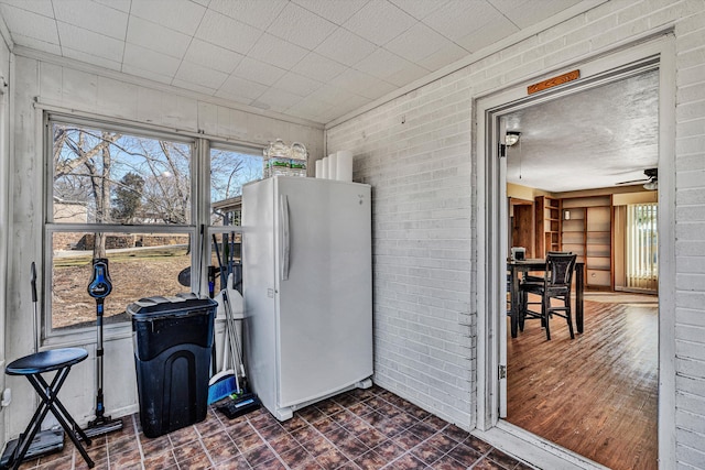 sunroom / solarium featuring ceiling fan