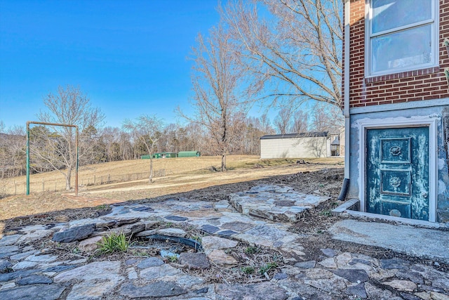 view of patio / terrace featuring a storage shed