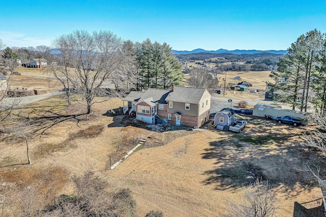 birds eye view of property with a mountain view