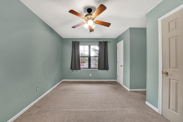 carpeted empty room with ceiling fan