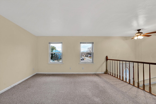 carpeted empty room with ceiling fan