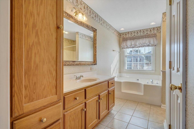 bathroom with vanity, a bathing tub, and tile patterned flooring