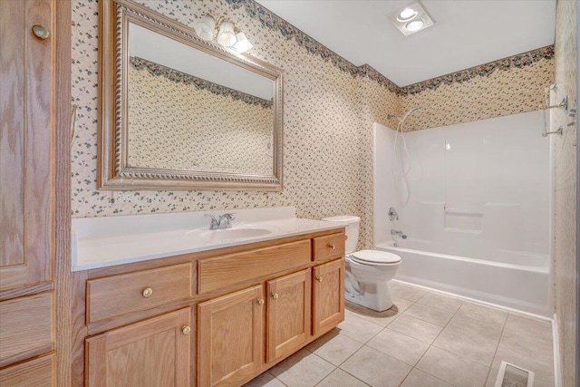 full bathroom with  shower combination, toilet, tile patterned flooring, and vanity