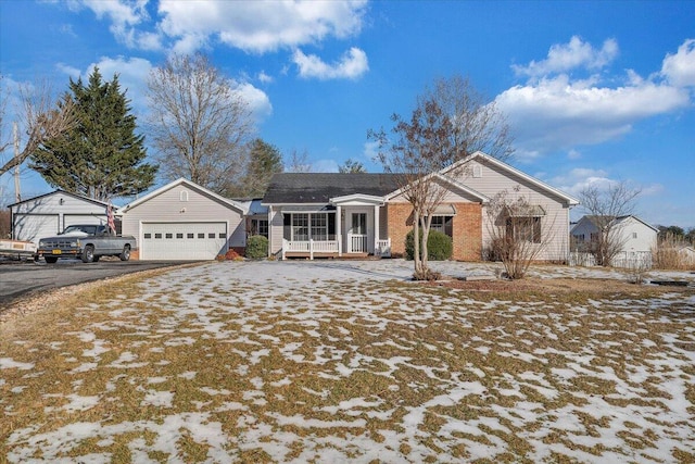 view of front of home featuring a garage and an outdoor structure