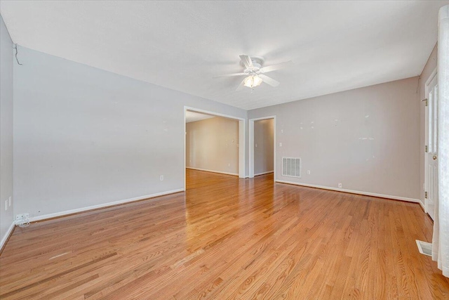 spare room featuring ceiling fan and light hardwood / wood-style flooring