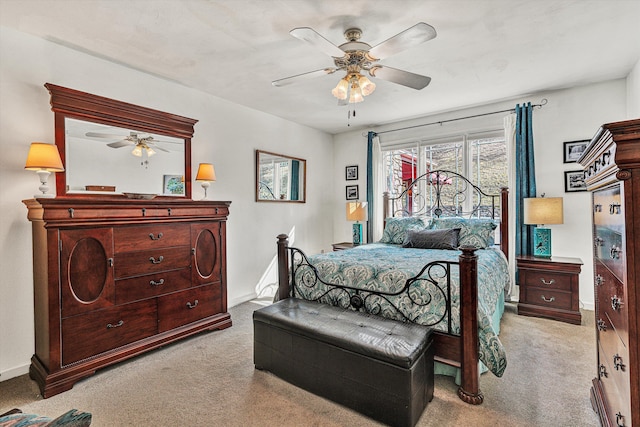 bedroom with light carpet, access to outside, and ceiling fan