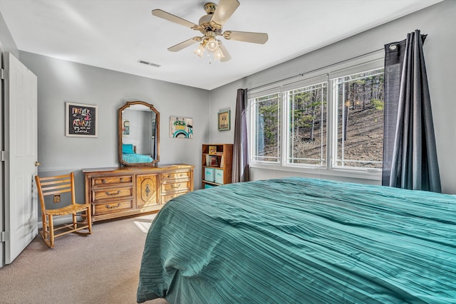 carpeted bedroom featuring ceiling fan