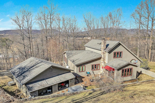 birds eye view of property featuring a mountain view