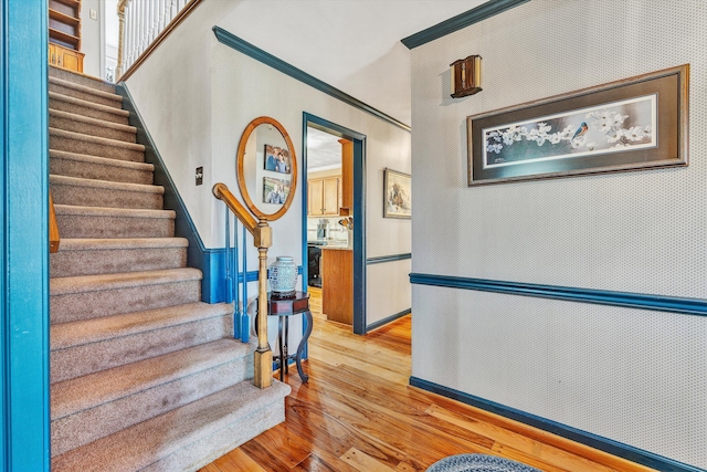 stairs featuring hardwood / wood-style flooring