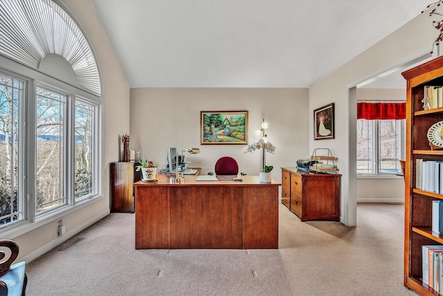 carpeted office featuring a wealth of natural light and vaulted ceiling