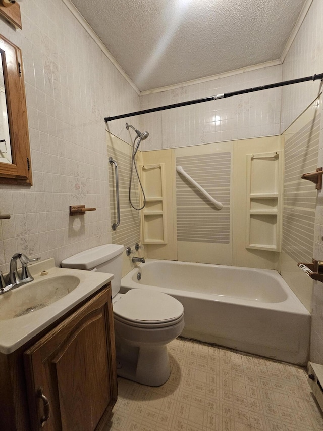 full bathroom featuring toilet, tile walls, a textured ceiling, shower / tub combination, and vanity