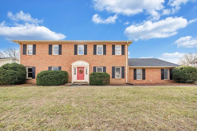 colonial-style house with a front lawn